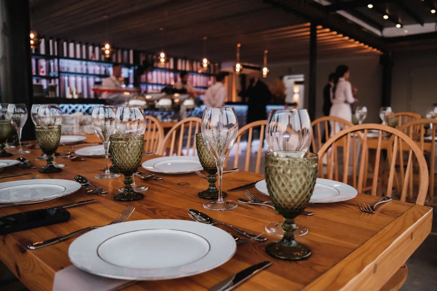 Warm restaurant dining room prepared for guests
