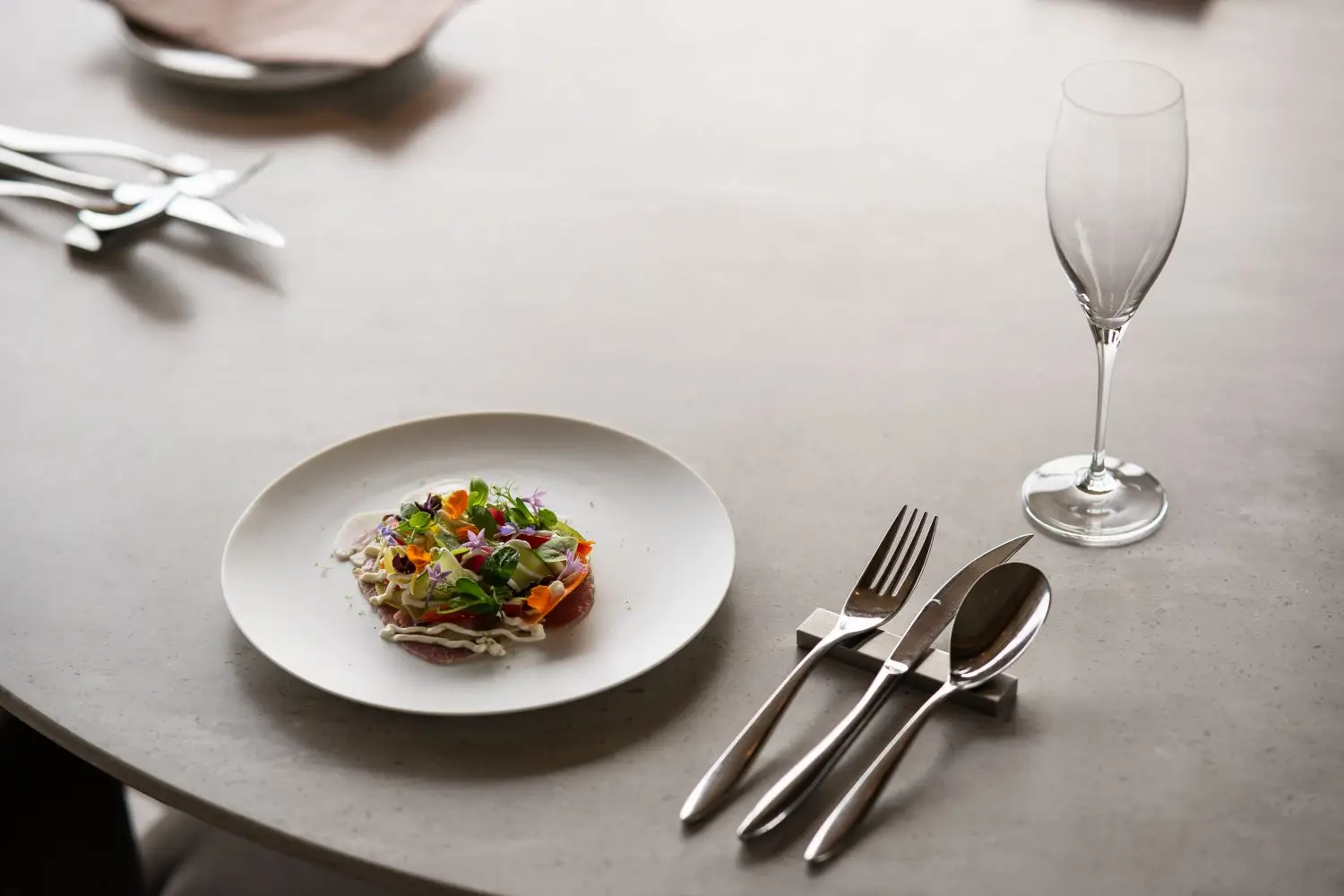 Refined restaurant plate set at a dining table